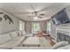 Spacious living room featuring a fireplace, hardwood floors, and large sectional couch at 6 Sentry Rdg, Dallas, GA 30157