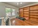 Inviting living room featuring hardwood floors, custom built-in shelving, and ample natural light at 6 Sentry Rdg, Dallas, GA 30157