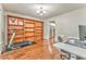 Inviting living room featuring hardwood floors, custom built-in shelving, and neutral paint at 6 Sentry Rdg, Dallas, GA 30157