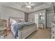 Calm main bedroom features a cozy bed, ceiling fan, and ample natural light creating a relaxing retreat at 6 Sentry Rdg, Dallas, GA 30157
