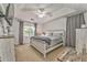 Serene main bedroom with a cozy bed, ceiling fan, and ample natural light creating a relaxing retreat at 6 Sentry Rdg, Dallas, GA 30157