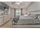 Serene main bedroom with a cozy bed, ceiling fan, and ample natural light creating a relaxing retreat at 6 Sentry Rdg, Dallas, GA 30157