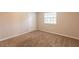 Bedroom featuring carpet floors, white closet doors, and a window with blinds at 110 Valley View Ct, Tyrone, GA 30290