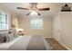 Staged bedroom with soft lighting and carpet flooring at 110 Valley View Ct, Tyrone, GA 30290