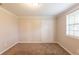 Bedroom featuring carpet floors, white closet doors, and a window with blinds at 110 Valley View Ct, Tyrone, GA 30290