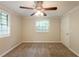 Bright bedroom featuring carpet flooring and natural light at 110 Valley View Ct, Tyrone, GA 30290