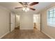 Neutral bedroom showcasing carpet floors, ceiling fan, and two entry door frames at 110 Valley View Ct, Tyrone, GA 30290