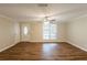 Spacious living room featuring wood-look flooring and a large window for natural light at 110 Valley View Ct, Tyrone, GA 30290