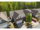 Aerial view of a two-story home with brick facade, two car garage, and a well-manicured yard at 123 Heritage Pointe, Woodstock, GA 30189
