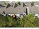 A home featuring a deck and patio area, backing onto a lush wooded area, providing privacy and a natural view at 123 Heritage Pointe, Woodstock, GA 30189