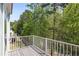 Balcony overlooking a wooded area at 123 Heritage Pointe, Woodstock, GA 30189