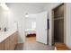 Modern bathroom with sleek vanity, neutral tile, and a glass-enclosed shower at 123 Heritage Pointe, Woodstock, GA 30189