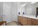 Bright bathroom featuring a double vanity with modern fixtures and a large mirror with great lighting at 123 Heritage Pointe, Woodstock, GA 30189