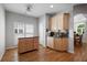Cozy breakfast nook with custom cabinets, granite counters, hardwood floors, and a window for natural light, great for casual dining at 123 Heritage Pointe, Woodstock, GA 30189