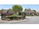 Beautiful community entrance featuring water features and landscaping, creating a welcoming atmosphere at 123 Heritage Pointe, Woodstock, GA 30189