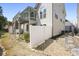 Charming home exterior with fenced yard, landscaping, and a mix of gravel and stone at 123 Heritage Pointe, Woodstock, GA 30189