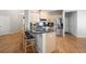Bright kitchen featuring granite countertops, stainless steel appliances, and ample counter space at 123 Heritage Pointe, Woodstock, GA 30189