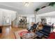 Open-concept living room with hardwood floors and natural light at 123 Heritage Pointe, Woodstock, GA 30189