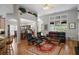 Spacious living area with hardwood floors, a large window, and a view of the kitchen and dining space at 123 Heritage Pointe, Woodstock, GA 30189