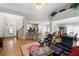 Open-concept living room and kitchen with hardwood floors and abundant natural light at 123 Heritage Pointe, Woodstock, GA 30189