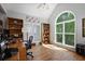 Bright and airy office with hardwood floors, vaulted ceilings and arched windows overlooking trees at 123 Heritage Pointe, Woodstock, GA 30189