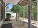 Cozy covered patio featuring stone flooring and views of the backyard at 123 Heritage Pointe, Woodstock, GA 30189