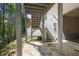 Stone patio showing backyard and staircase to the deck above at 123 Heritage Pointe, Woodstock, GA 30189