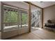 Covered patio with screened walls and view of a staircase at 123 Heritage Pointe, Woodstock, GA 30189