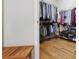 Spacious walk-in closet with hardwood floors and ample storage racks and shelving at 123 Heritage Pointe, Woodstock, GA 30189