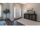 Inviting entryway featuring hardwood floors, a stylish cabinet, and decorative wall art at 259 Eason St, Bowdon, GA 30108
