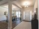 Elegant entryway with beautiful hardwood floors leading into the dining room with a large window at 259 Eason St, Bowdon, GA 30108