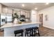 Modern kitchen with stainless steel appliances, granite countertops, and bar seating at 259 Eason St, Bowdon, GA 30108
