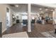Open-concept space with a fireplace, kitchen island with bar seating, and hardwood floors at 259 Eason St, Bowdon, GA 30108
