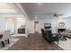 Open living space showcasing hardwood floors, fireplace, and entry to the dining area at 259 Eason St, Bowdon, GA 30108