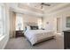 A spacious primary bedroom boasts trey ceilings and lots of natural light at 259 Eason St, Bowdon, GA 30108