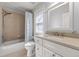 Bathroom featuring a shower-tub combo, window, toilet, and a vanity with a light countertop at 2823 Seagrave Way, Marietta, GA 30066
