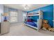 Bright bedroom features a bunk bed with a ladder and whimsical blue accents at 2823 Seagrave Way, Marietta, GA 30066