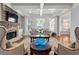 Bright living room with stone fireplace, beamed ceilings, large windows, and elegant furnishings at 2823 Seagrave Way, Marietta, GA 30066
