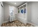 Well-organized mudroom with built-in storage, sink, and attractive flooring at 2823 Seagrave Way, Marietta, GA 30066