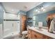 Stylish bathroom with walk-in shower, wood accents, and neutral colors at 2010 Univeter Rd, Canton, GA 30115