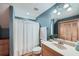 Cozy bathroom with a shower, and vanity, all illuminated by natural light at 2010 Univeter Rd, Canton, GA 30115