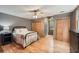 Cozy bedroom with hardwood floors, a ceiling fan, and natural light from the window at 2010 Univeter Rd, Canton, GA 30115