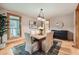 Inviting dining room with wood floors, neutral colors, and natural light at 2010 Univeter Rd, Canton, GA 30115