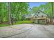 View of home featuring a basketball court and garage at 2010 Univeter Rd, Canton, GA 30115