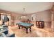 Entertainment space with a billiards table, hardwood floors, and ample natural light at 2010 Univeter Rd, Canton, GA 30115