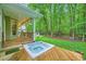 Relaxing hot tub with deck and backyard at 2010 Univeter Rd, Canton, GA 30115