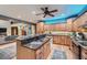 Spacious kitchen with wood cabinets, granite countertops, and stainless steel appliances at 2010 Univeter Rd, Canton, GA 30115