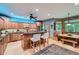 Modern kitchen featuring wood cabinets, an island with bar seating, and an adjacent breakfast nook at 2010 Univeter Rd, Canton, GA 30115