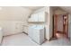 Functional laundry room with washer, dryer, and ample storage space at 2010 Univeter Rd, Canton, GA 30115