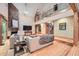 Inviting living room with stone fireplace, hardwood floors, and second story balcony at 2010 Univeter Rd, Canton, GA 30115